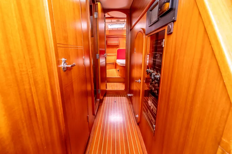 Slide: The Image of Interior of 1997 Farr 60 Pilot House yacht with wooden paneling and cozy cabin. - 32