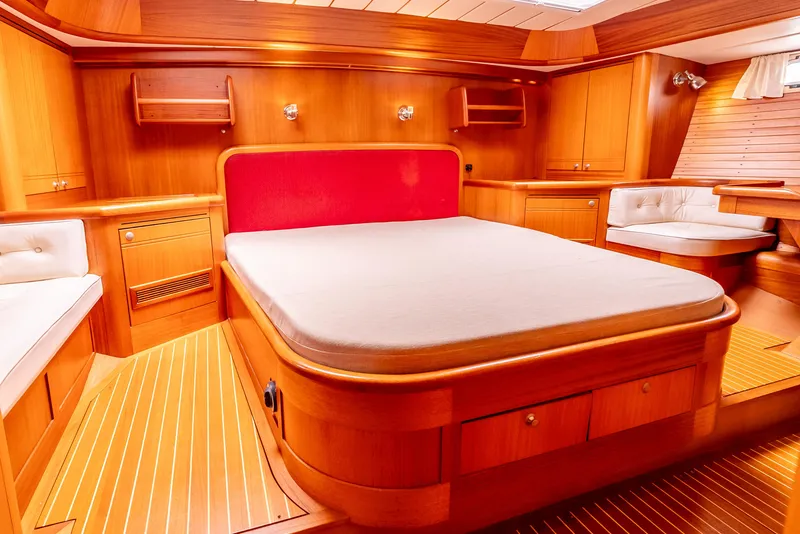 Slide: The Image of Luxurious wooden interior of 1997 Farr 60 Pilot House yacht bedroom. - 33