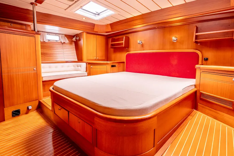 Slide: The Image of Luxurious wood-finished cabin interior of 1997 Farr 60 Pilot House yacht. - 34
