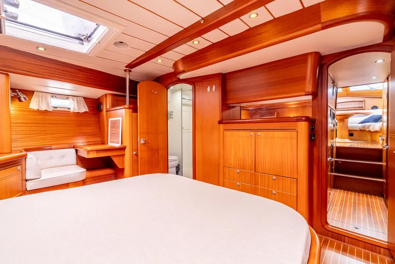 Slide: The Image of Luxurious interior of 1997 Farr 60 Pilot House yacht with wood finish and cozy seating. - 36