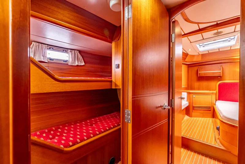 Slide: The Image of Interior of 1997 Farr 60 Pilot House yacht with wooden finish and cozy cabin. - 38