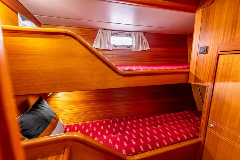 Slide: The Image of Bunk beds in 1997 Farr 60 Pilot House yacht cabin with wooden interior. - 39
