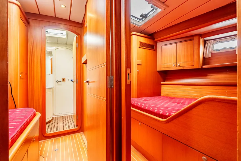 Slide: The Image of Interior of 1997 Farr 60 Pilot House yacht with wooden finish and cozy cabin. - 44