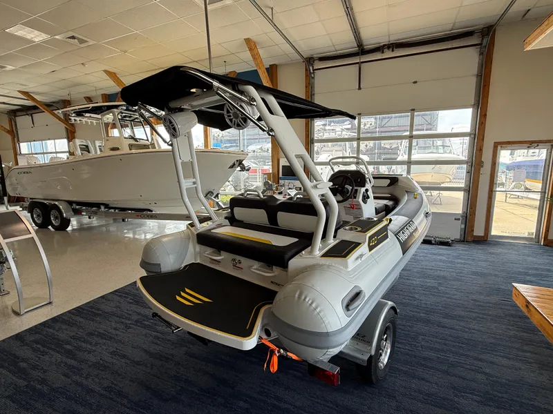 Slide: The Image of 2025 Highfield Velox 420 inflatable boat displayed indoors on a trailer. - 3