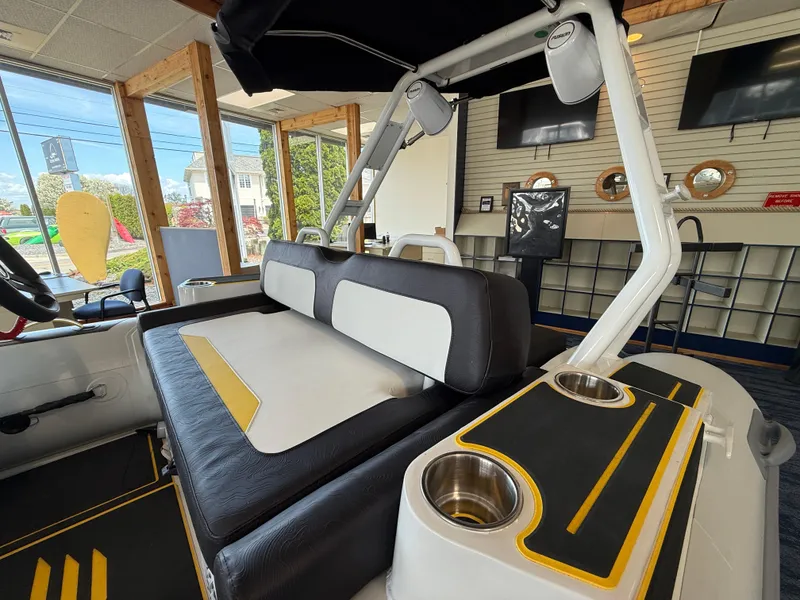 Slide: The Image of 2025 Highfield Velox 420 boat interior with cushioned seating and cup holders. - 6