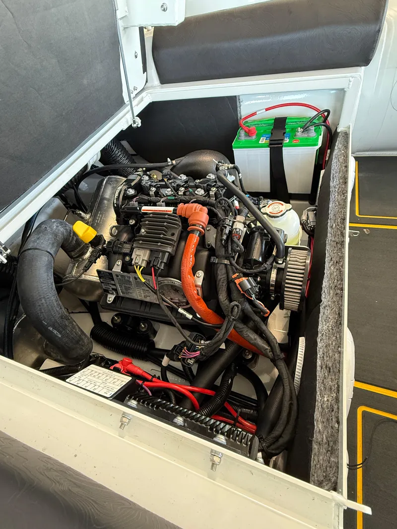 Slide: The Image of Engine compartment of 2025 Highfield Velox 420 with visible battery and wiring. - 9