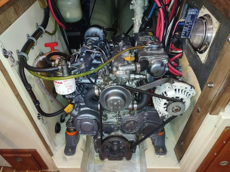 Slide: The Image of Engine compartment of a 1997 Pacific Seacraft 37 sailboat, featuring a Yanmar diesel engine. - 46