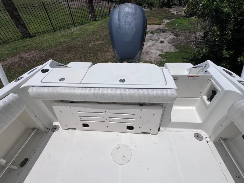 Slide: The Image of 2005 Hydra-Sports Vector 2400 CC boat interior with seating and engine view. - 13