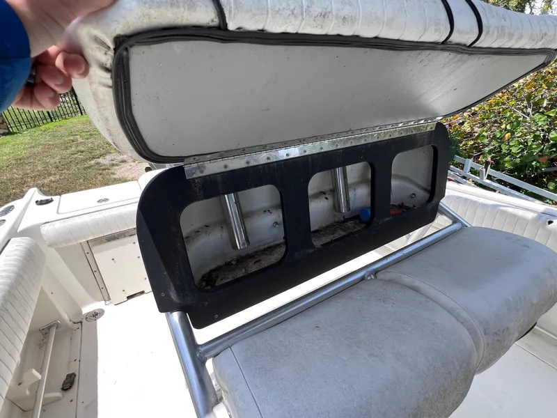Slide: The Image of 2005 Hydra-Sports Vector 2400 CC boat seat storage compartment open, revealing interior space. - 20