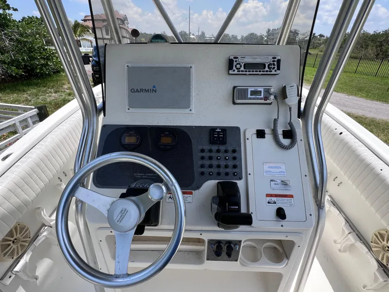 Slide: The Image of 2005 Hydra-Sports Vector 2400 CC boat console with Garmin navigation system and steering wheel. - 21