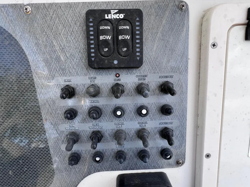 Slide: The Image of Control panel of a 2005 Hydra-Sports Vector 2400 CC boat with Lenco trim tab switches. - 23
