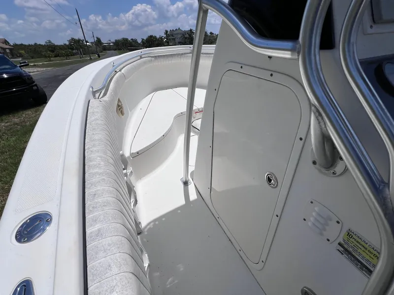 Slide: The Image of 2005 Hydra-Sports Vector 2400 CC boat interior with white seating and storage compartment. - 24
