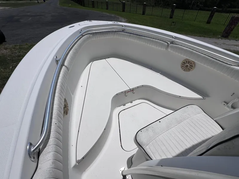 Slide: The Image of 2005 Hydra-Sports Vector 2400 CC boat interior with white seating and stainless steel railings. - 28