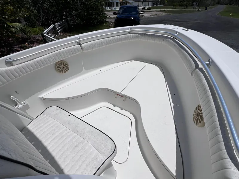 Slide: The Image of 2005 Hydra-Sports Vector 2400 CC boat interior with white seating and speakers. - 29