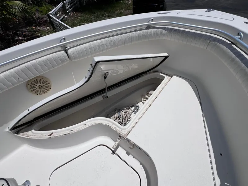 Slide: The Image of 2005 Hydra-Sports Vector 2400 CC boat with open storage compartment and coiled rope. - 30