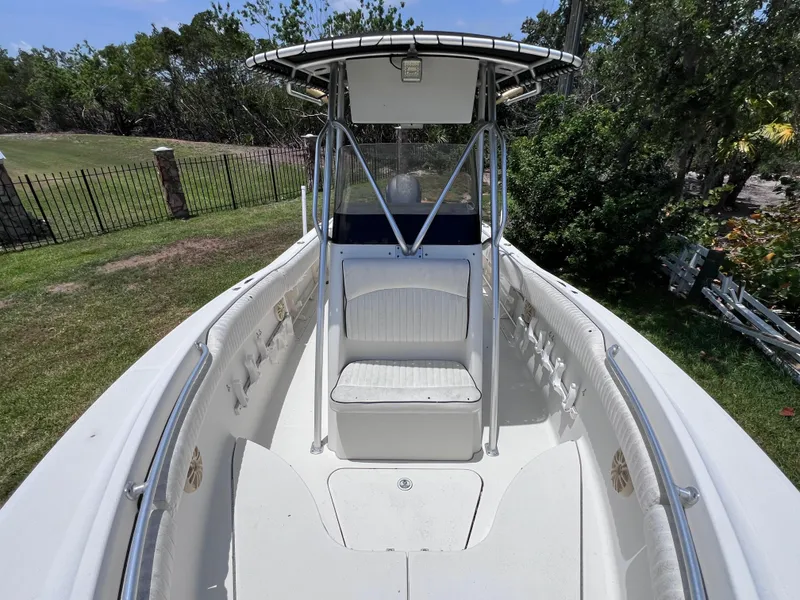 Slide: The Image of 2005 Hydra-Sports Vector 2400 CC boat, center console view, parked on grass. - 31