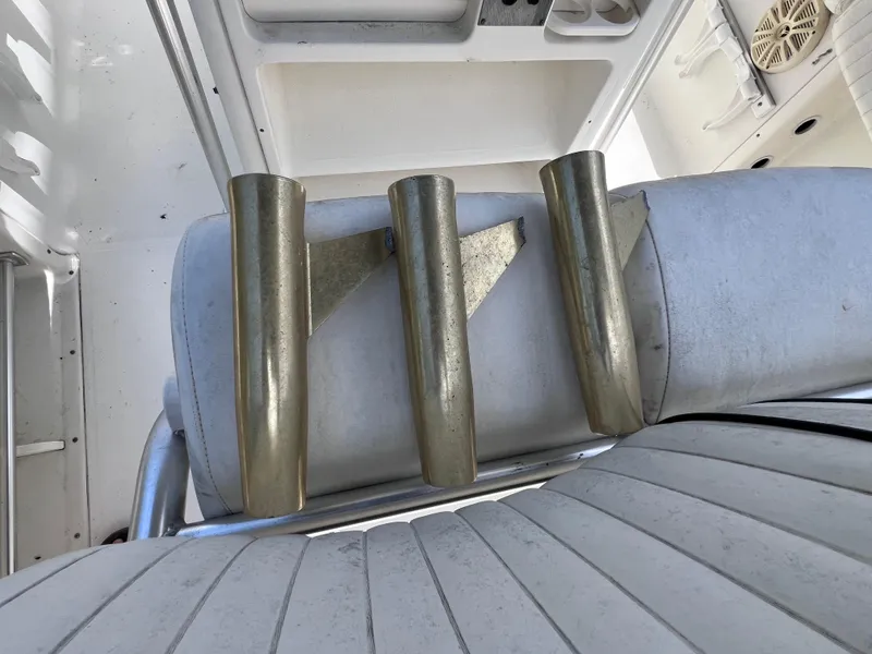 Slide: The Image of 2005 Hydra-Sports Vector 2400 CC boat interior with rod holders on seat. - 37