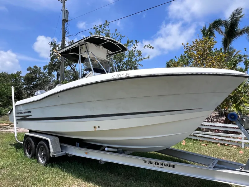 Slide: The Image of 2005 Hydra-Sports Vector 2400 CC boat on trailer, parked on grass under blue sky. - 6