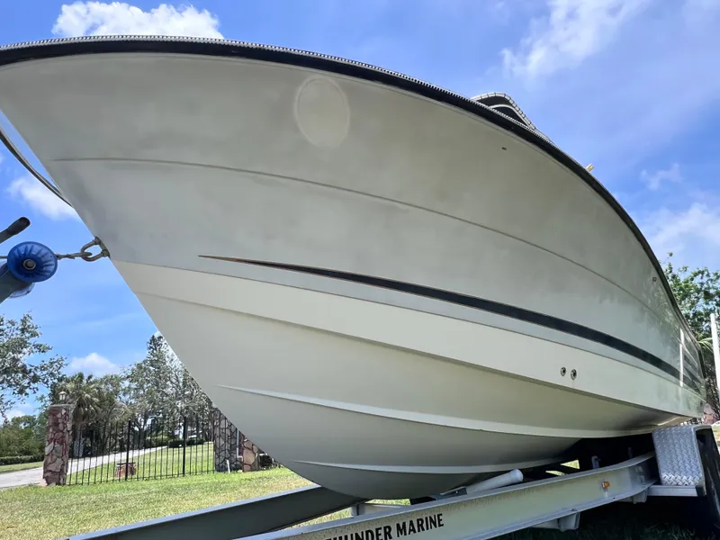 Slide: The Image of 2005 Hydra-Sports Vector 2400 CC boat on trailer under blue sky. - 8