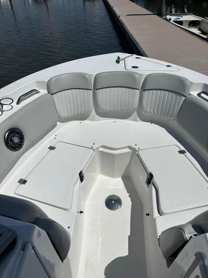 Slide: The Image of 2024 Sea Fox 226 Traveler boat interior with cushioned seating and storage compartments. - 10