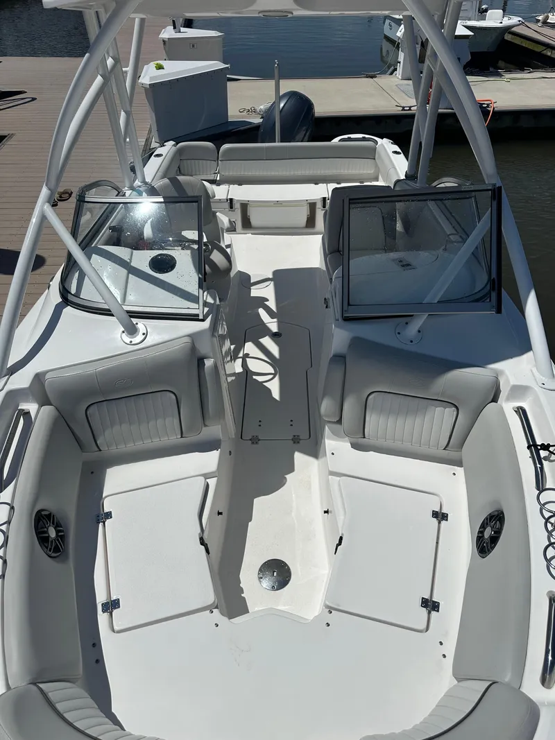 Slide: The Image of 2024 Sea Fox 226 Traveler boat interior with open seating and dual consoles. - 11