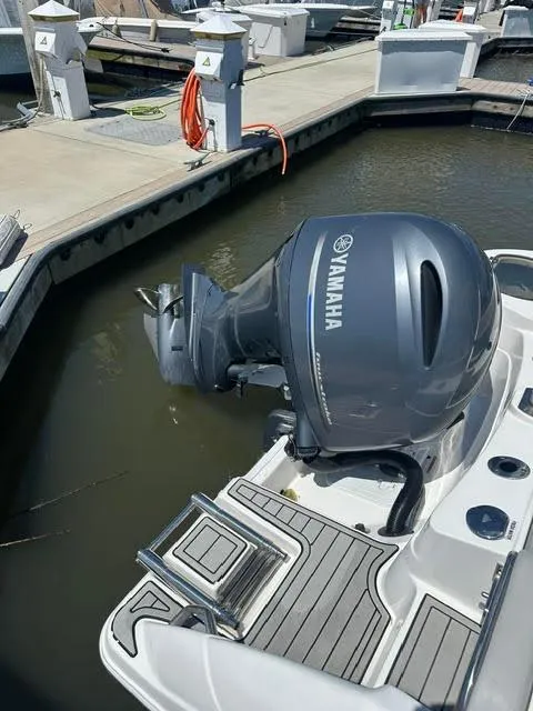 Slide: The Image of 2024 Sea Fox 226 Traveler with Yamaha outboard engine docked at marina. - 13