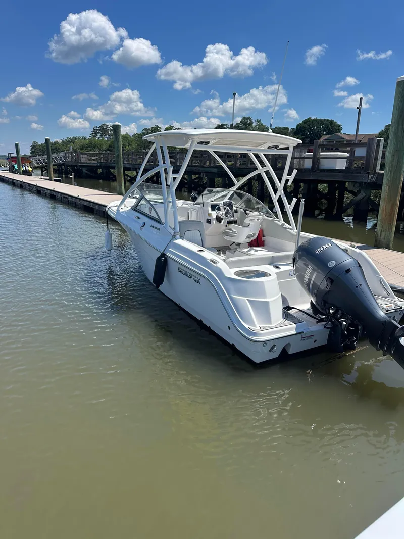 Slide: The Image of 2024 Sea Fox 226 Traveler boat docked on a sunny day. - 15