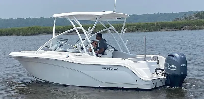 Slide: The Image of 2024 Sea Fox 226 Traveler boat cruising on a calm river with two passengers. - 17