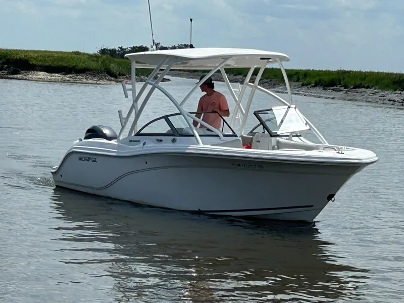 Slide: The Image of 2024 Sea Fox 226 Traveler boat cruising on calm water with a person onboard. - 5