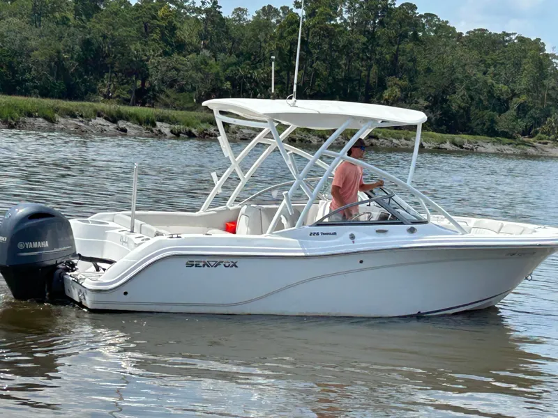 Slide: The Image of 2024 Sea Fox 226 Traveler boat on calm water with Yamaha engine. - 7