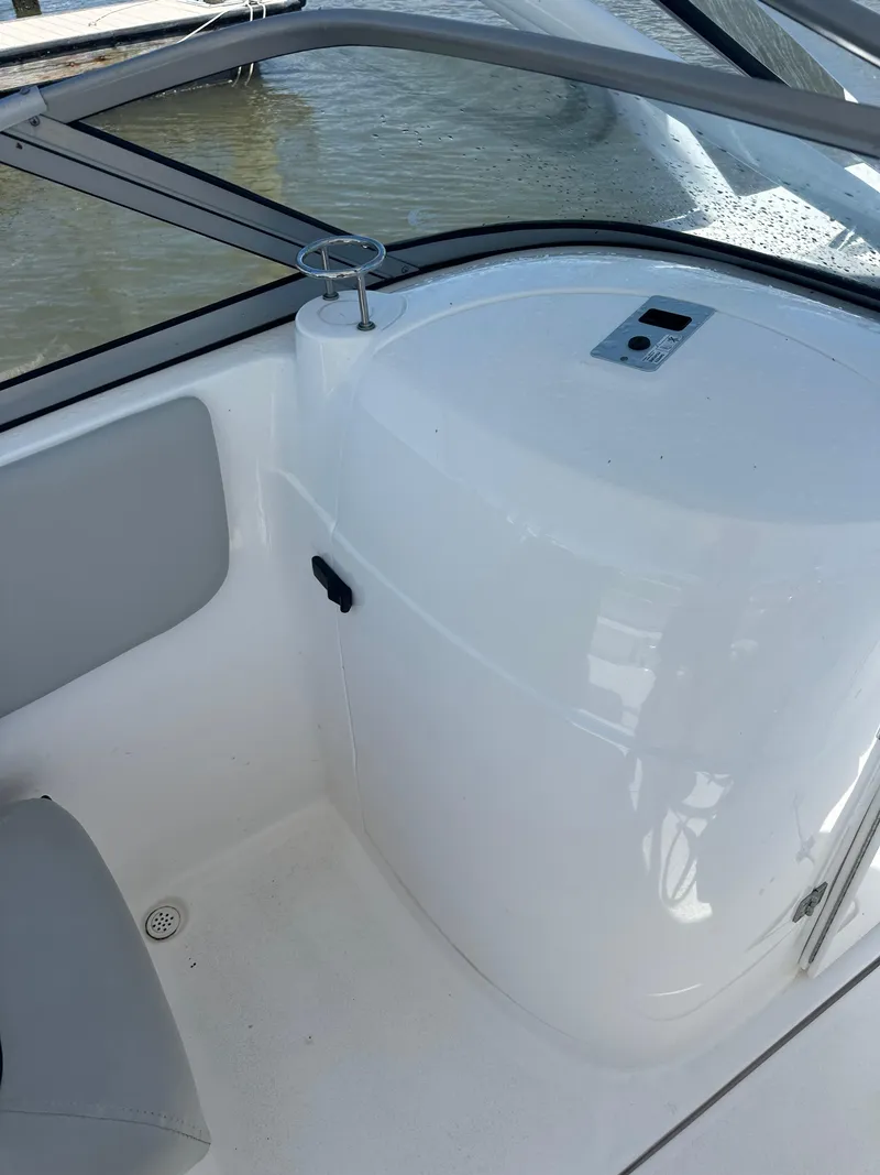 Slide: The Image of 2024 Sea Fox 226 Traveler boat interior with seating and storage compartment. - 8