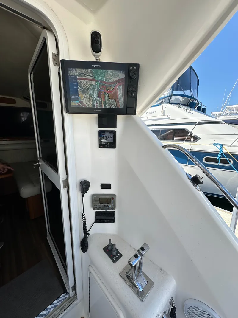 Slide: The Image of Control panel of a 2003 Riviera 37 Flybridge yacht with navigation equipment. - 10