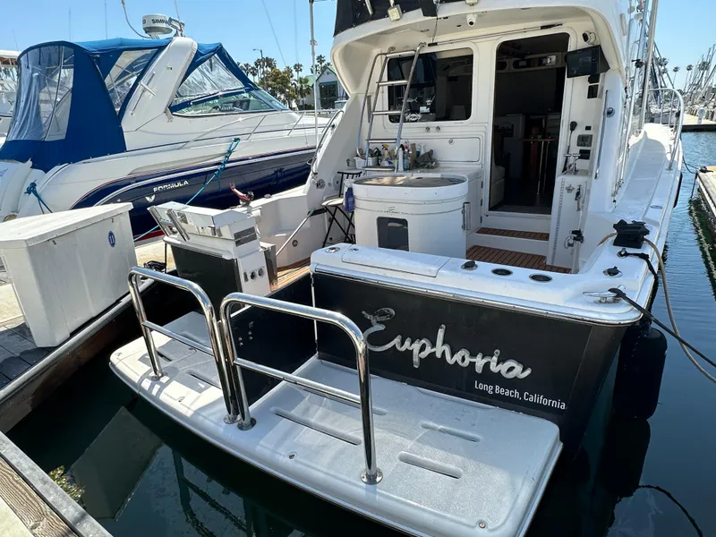 Slide: The Image of 2003 Riviera 37 Flybridge yacht named "Euphoria" docked in Long Beach, California. - 35