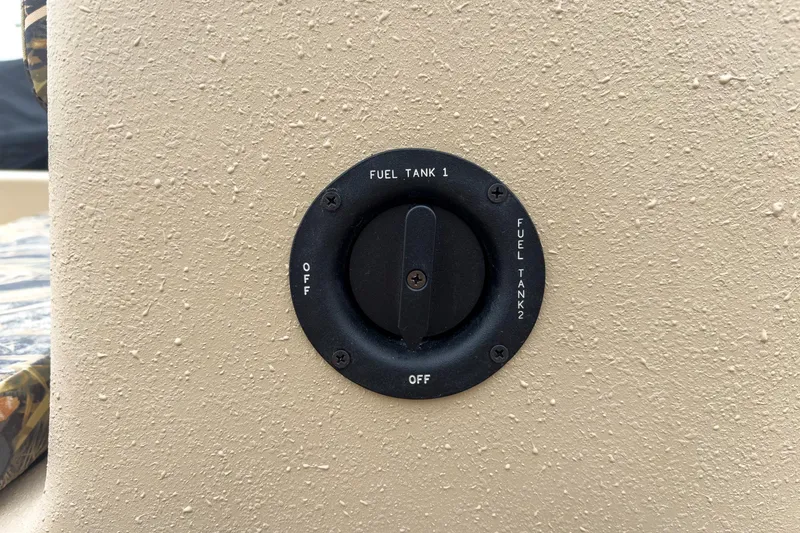 Slide: The Image of Fuel selector switch on 2026 Carolina Skiff E20 JVX CC Sportsman boat. - 10