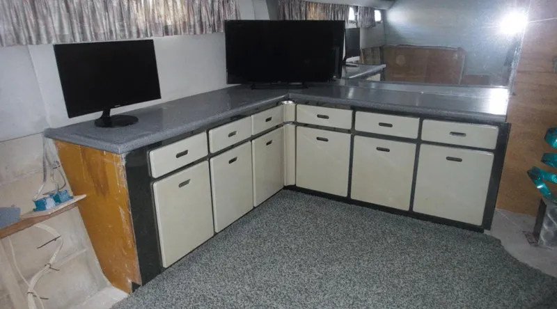 Slide: The Image of Interior of 1991 New York Yachts 88 with cabinets and dual monitors. - 11