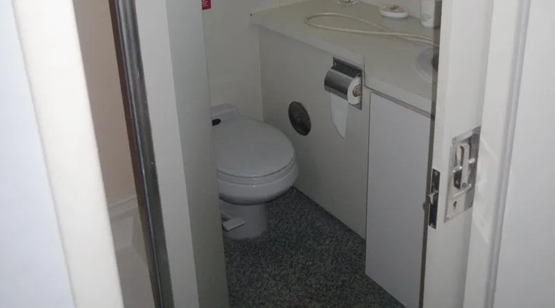 Slide: The Image of Small yacht bathroom with toilet and sink, New York Yachts 88, 1991 model. - 14