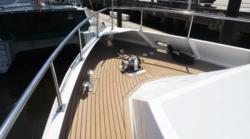 Slide: The Image of Bow deck of 1991 New York Yachts 88 with wooden finish and railing. - 30