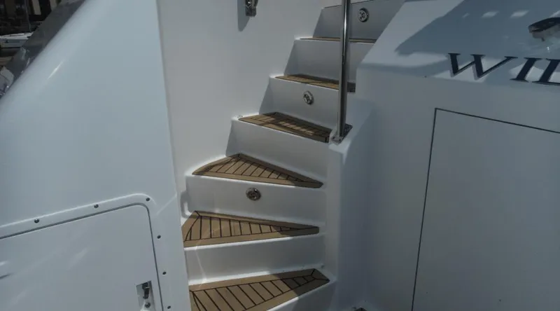 Slide: The Image of Staircase on 1991 Custom New York Yachts 88 with teak steps and white railing. - 34