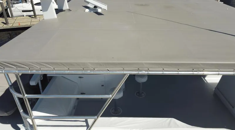 Slide: The Image of Rooftop view of 1991 Custom New York Yachts 88 with covered seating area. - 38