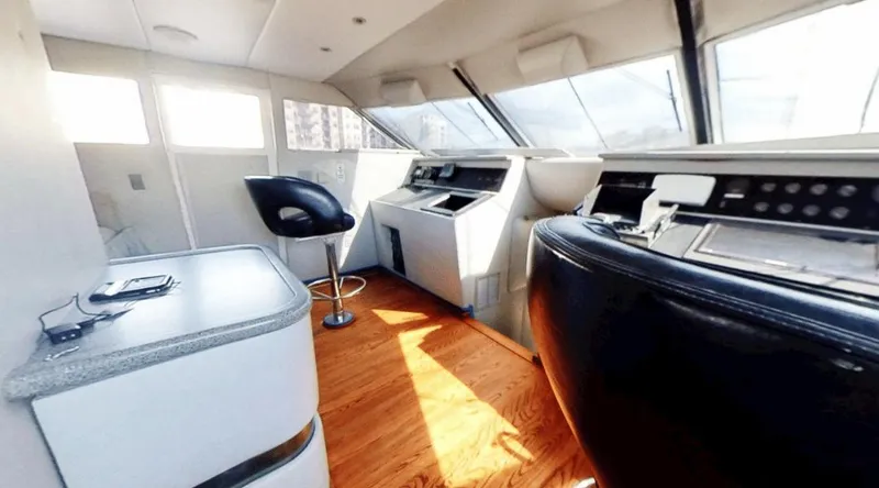 Slide: The Image of Luxurious helm of 1991 New York Yachts 88 with modern controls and seating. - 8