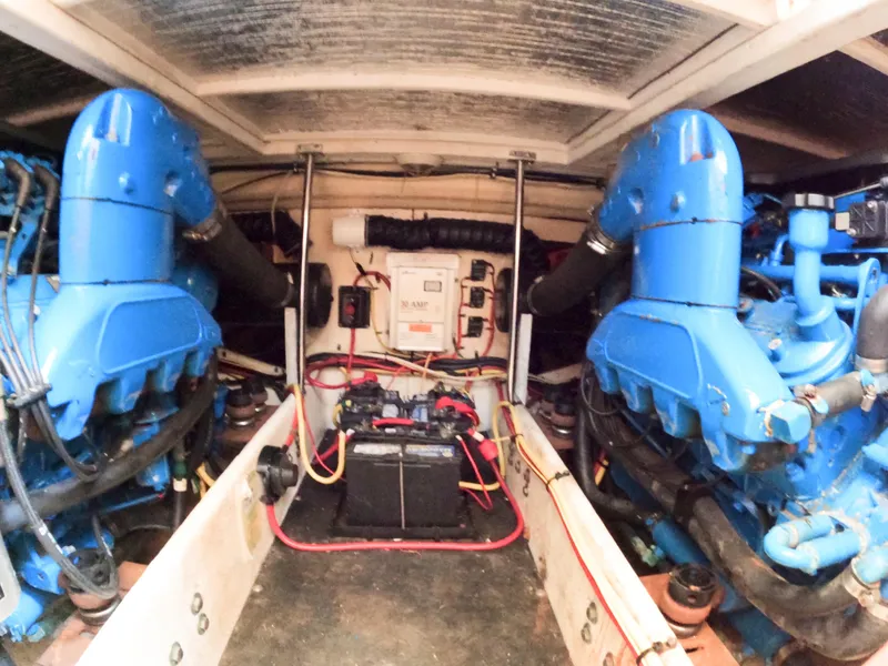Slide: The Image of Engine room of 2008 Silverton 33 Convertible with dual blue engines and electrical components. - 17