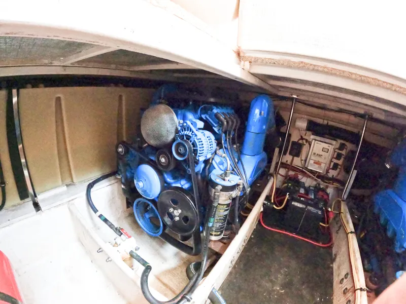 Slide: The Image of Engine room of a 2008 Silverton 33 Convertible boat, featuring a blue engine. - 18