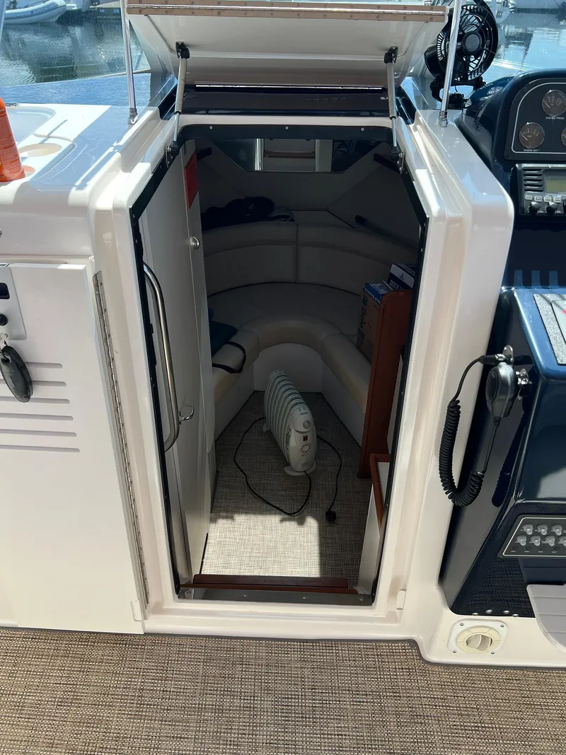 Slide: The Image of 2006 Tiara Yachts 2900 Coronet cabin entrance with interior view and heater. - 21