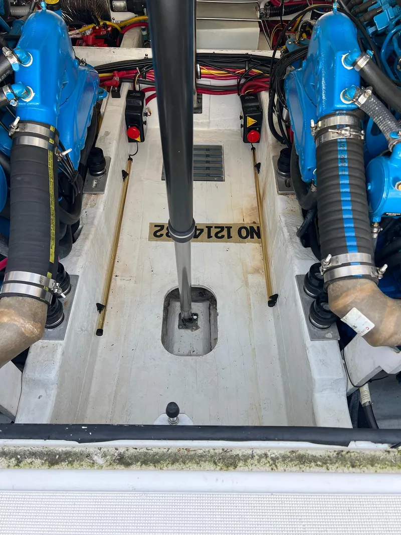 Slide: The Image of Engine compartment of a 2006 Tiara Yachts 2900 Coronet with blue engines and wiring. - 31