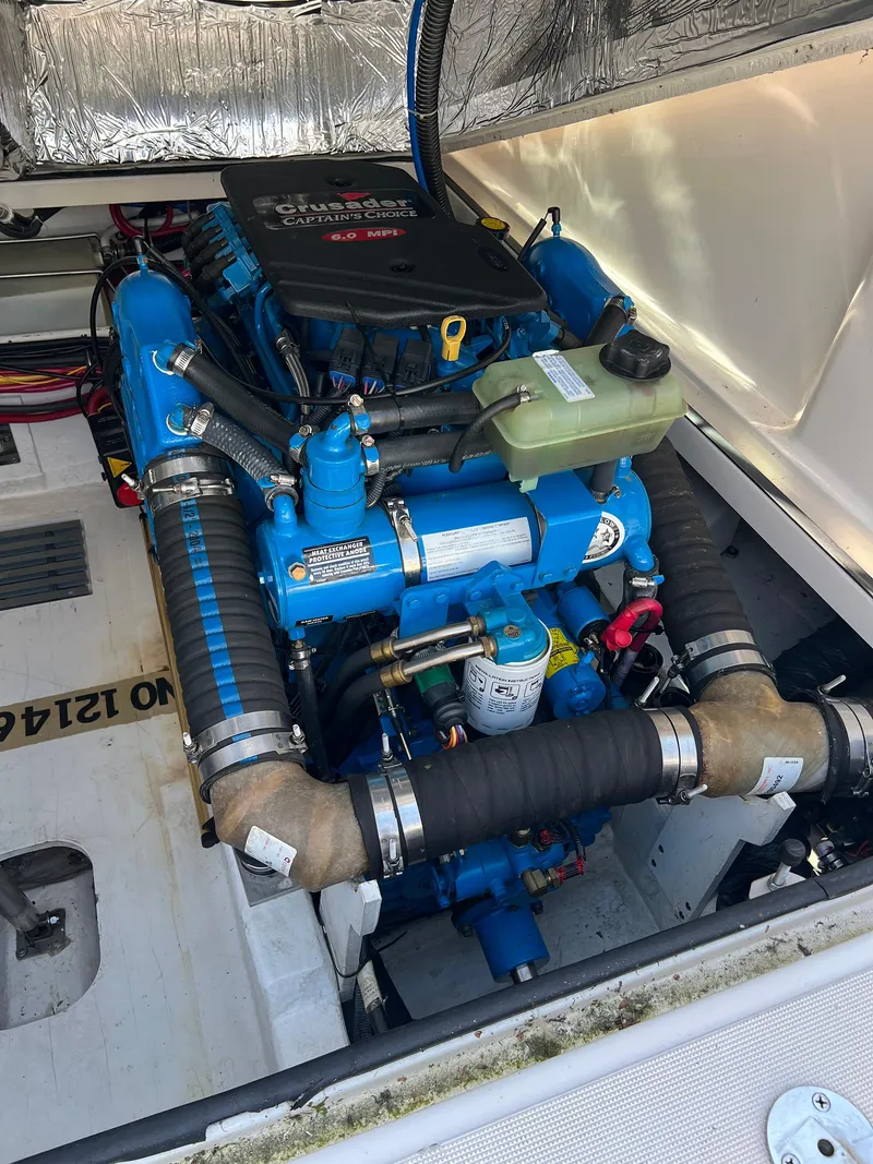 Slide: The Image of Engine compartment of a 2006 Tiara Yachts 2900 Coronet, featuring a Crusader engine. - 32
