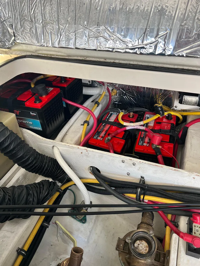 Slide: The Image of Engine compartment of a 2006 Tiara Yachts 2900 Coronet with multiple batteries and wiring. - 33