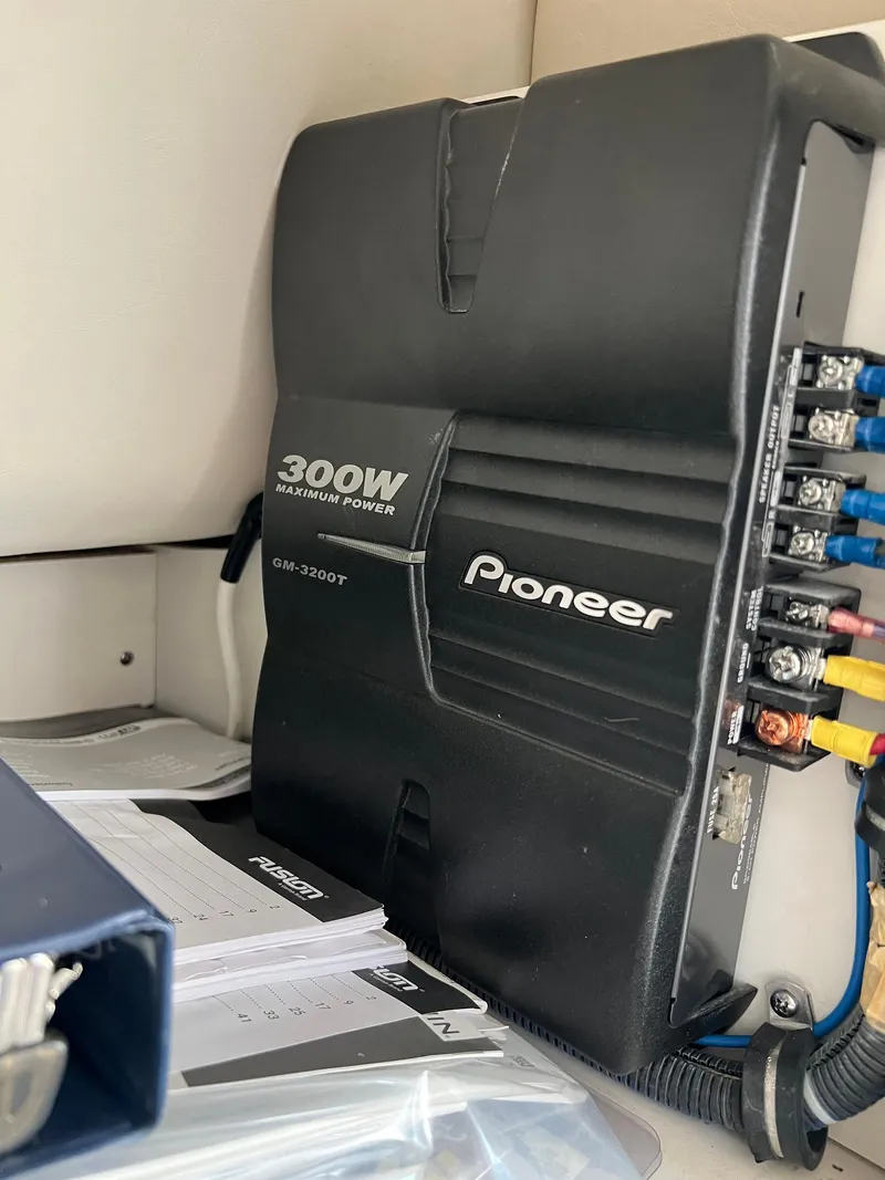 Slide: The Image of Pioneer 300W amplifier in a 2006 Tiara Yachts 2900 Coronet, with wiring and documents nearby. - 35