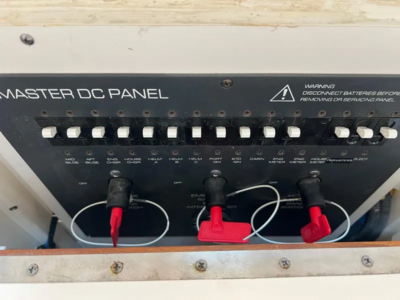 Slide: The Image of Master DC panel on 2006 Tiara Yachts 2900 Coronet, featuring switches and warning label. - 36