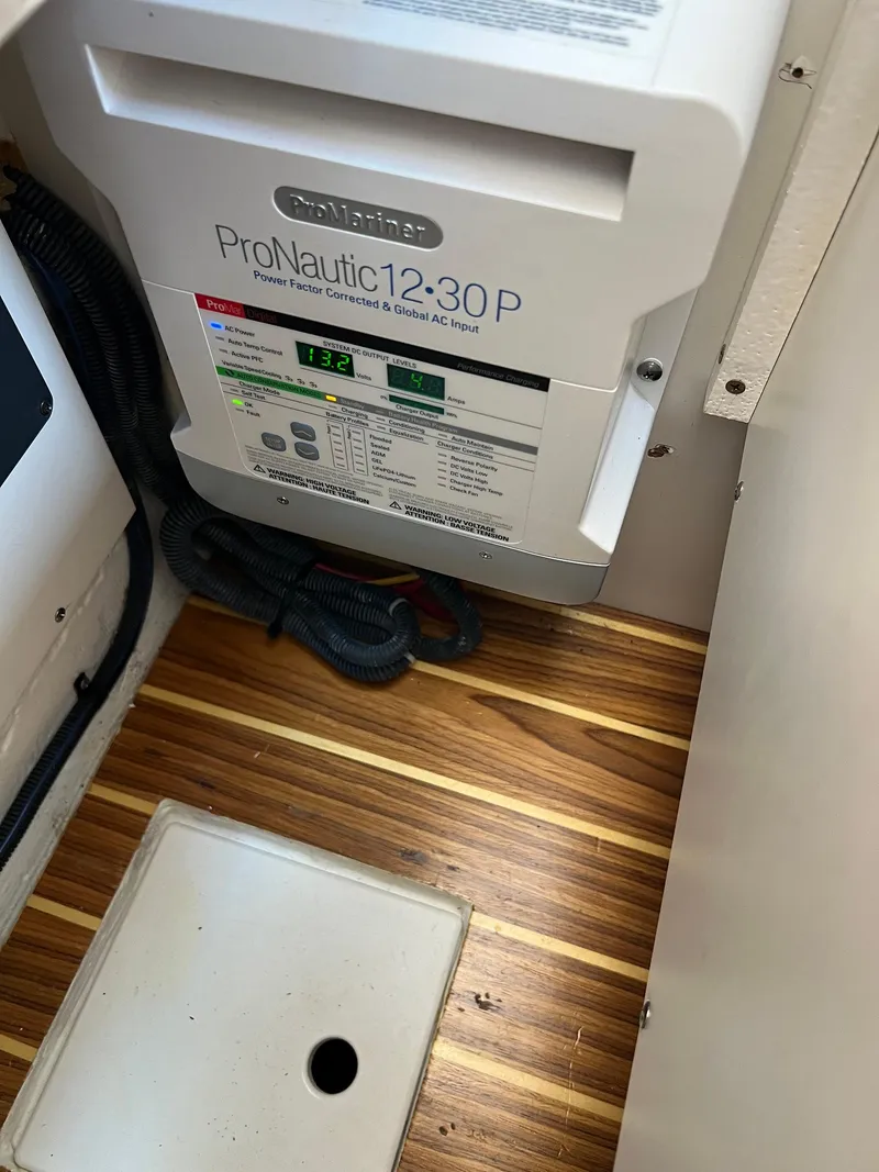 Slide: The Image of ProNautic 12-30P charger in 2006 Tiara Yachts 2900 Coronet, on wooden floor. - 37