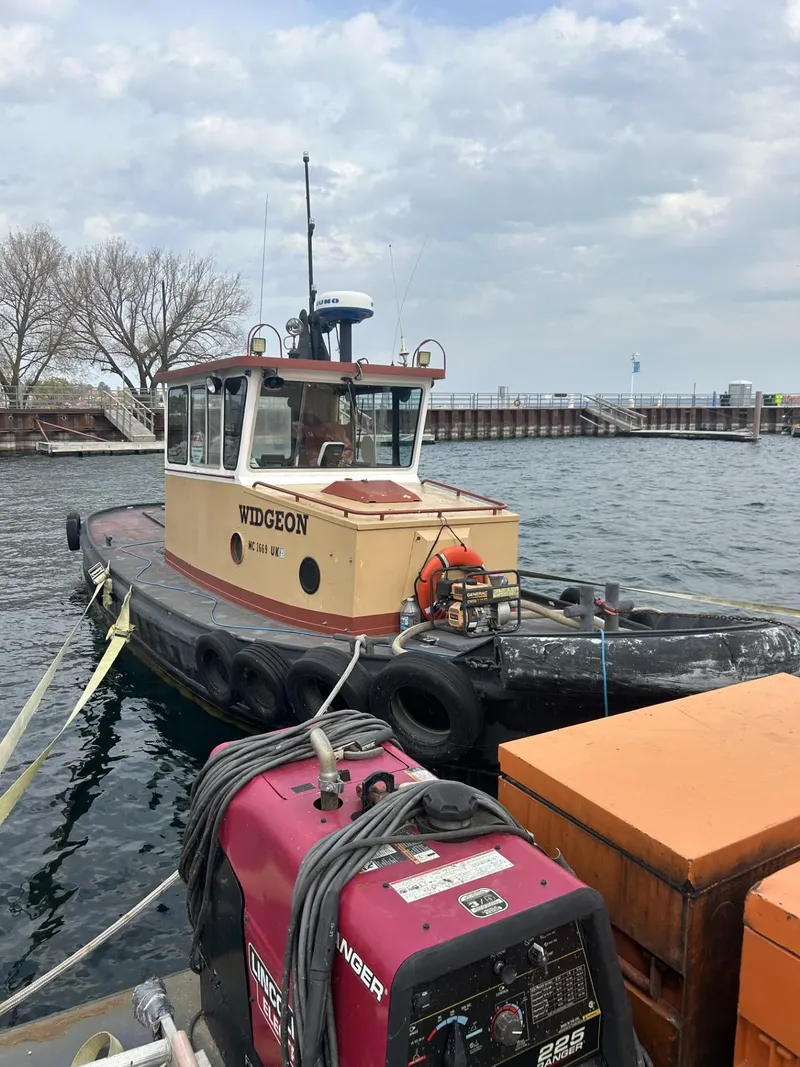 Slide: The Image of Vintage 1960 custom commercial tugboat "Widgeon" docked by the waterfront. - 3